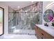 A luxurious main bathroom features a glass shower with marble walls, bench, and modern fixtures at 541 Earlvine Nw Way, Kennesaw, GA 30152