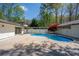 Backyard pool area features a unique red tree and a large sun deck at 541 Earlvine Nw Way, Kennesaw, GA 30152