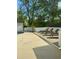 Backyard pool area with lounge chairs and a wooden deck on a sunny day at 541 Earlvine Nw Way, Kennesaw, GA 30152