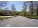 Street view showcasing the neighborhood and surrounding greenery at 541 Earlvine Nw Way, Kennesaw, GA 30152