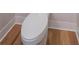 Toilet featuring modern design and complemented by stylish flooring at 541 Earlvine Nw Way, Kennesaw, GA 30152