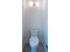 Neat toilet with modern lighting fixtures against a clean white wall at 541 Earlvine Nw Way, Kennesaw, GA 30152