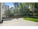 Paved backyard area with manicured lawn, mature trees, and privacy fencing at 2198 Oakawana Ne Dr, Atlanta, GA 30345