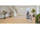 Finished basement with sleek bar area, stairs, and modern design features at 2198 Oakawana Ne Dr, Atlanta, GA 30345