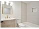 Bright bathroom with a vanity and framed mirror next to a soaking tub with shower at 2198 Oakawana Ne Dr, Atlanta, GA 30345