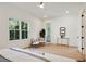Airy bedroom features large windows, light hardwood floors, and a ceiling fan at 2198 Oakawana Ne Dr, Atlanta, GA 30345