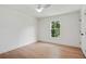 Bright bedroom featuring a ceiling fan and large window at 2198 Oakawana Ne Dr, Atlanta, GA 30345