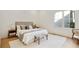 Bright bedroom with a large window, neutral decor, and hardwood floors throughout at 2198 Oakawana Ne Dr, Atlanta, GA 30345