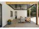 Relaxing covered patio with stylish seating, ceiling fan, and outdoor ambiance at 2198 Oakawana Ne Dr, Atlanta, GA 30345
