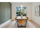 Dining room features a modern table with seating for six and large windows for natural light at 2198 Oakawana Ne Dr, Atlanta, GA 30345