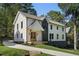 Beautiful two-story home with a covered front porch, stone foundation and nice landscaping at 2198 Oakawana Ne Dr, Atlanta, GA 30345