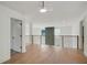 Upstairs hallway with wood floors, metal railings, and multiple doorways at 2198 Oakawana Ne Dr, Atlanta, GA 30345