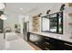 Modern kitchen features stainless steel appliances, a large island, and an expansive folding window at 2198 Oakawana Ne Dr, Atlanta, GA 30345