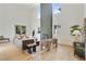 Sunlit living room with a modern fireplace, hardwood floors, stylish decor, and soaring ceilings at 2198 Oakawana Ne Dr, Atlanta, GA 30345
