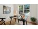 Bright office space with a modern desk, large window offering natural light, and hardwood floors at 2198 Oakawana Ne Dr, Atlanta, GA 30345