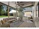 Covered patio featuring comfortable seating, ceiling fan, and backyard views at 2198 Oakawana Ne Dr, Atlanta, GA 30345