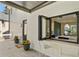 Inviting outdoor servery connected to the kitchen and expansive deck with seating at 2198 Oakawana Ne Dr, Atlanta, GA 30345