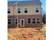 Back of new construction townhouse with brick and siding, and a sliding glass door at 3108 Marbella Cir # 4, Kennesaw, GA 30152