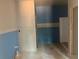 Unfinished bathroom showing blue-painted accent wall, plumbing, and doorway to separate shower at 3108 Marbella Cir # 4, Kennesaw, GA 30152