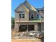 New construction two-story townhome featuring a brick facade and two-car garage at 3108 Marbella Cir # 4, Kennesaw, GA 30152