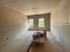 Unfinished living room featuring two windows and drywall nearly complete at 3108 Marbella Cir # 4, Kennesaw, GA 30152