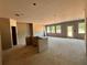 Spacious, unfinished living room with windows and a sliding glass door, ready for customization at 3108 Marbella Cir # 4, Kennesaw, GA 30152