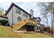 Spacious backyard featuring a large deck, patio, and well-maintained lawn at 622 Goldpoint Trce, Woodstock, GA 30189