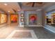 A finished basement boasting neutral walls, tile floors and multiple attractive wall art pieces at 622 Goldpoint Trce, Woodstock, GA 30189