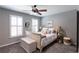 Bedroom featuring neutral colors, hardwood floors, and a ceiling fan at 622 Goldpoint Trce, Woodstock, GA 30189