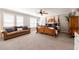 Spacious bedroom with luxurious four-poster bed and seating area at 622 Goldpoint Trce, Woodstock, GA 30189