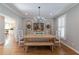 Charming dining room with hardwood floors, chandelier, and bright, neutral decor at 622 Goldpoint Trce, Woodstock, GA 30189