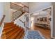 Grand foyer featuring hardwood floors, staircase with iron spindles, and formal dining room entrance at 622 Goldpoint Trce, Woodstock, GA 30189