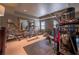 Home gym featuring mirror, multiple exercise machines and an open floor plan at 622 Goldpoint Trce, Woodstock, GA 30189
