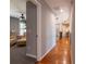 Bright hallway featuring hardwood floors connecting carpeted room at 622 Goldpoint Trce, Woodstock, GA 30189