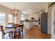 Bright kitchen featuring white cabinets, granite countertops, stainless steel appliances, and breakfast nook at 622 Goldpoint Trce, Woodstock, GA 30189
