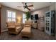 Cozy sitting area with two chairs, ottoman, and stylish furnishings at 622 Goldpoint Trce, Woodstock, GA 30189