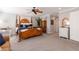 Well-lit main bedroom featuring a four-poster bed and ample space at 622 Goldpoint Trce, Woodstock, GA 30189