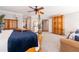 Large main bedroom featuring a four poster bed, and an armoire at 622 Goldpoint Trce, Woodstock, GA 30189