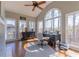 Bright office space featuring vaulted ceilings, large windows, a ceiling fan, and a stylish desk and cabinet at 622 Goldpoint Trce, Woodstock, GA 30189
