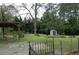 Expansive backyard featuring a shed, carport and mature trees at 1130 Ridge Ave, Stone Mountain, GA 30083