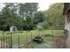 Expansive backyard featuring a shed and mature trees at 1130 Ridge Ave, Stone Mountain, GA 30083