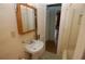 Bathroom with a pedestal sink, medicine cabinet, shower, and vintage charm at 1130 Ridge Ave, Stone Mountain, GA 30083