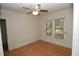 Cozy bedroom with wood floors, ceiling fan and natural light from the window at 1130 Ridge Ave, Stone Mountain, GA 30083