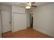 Bedroom featuring wood floors, closet, ceiling fan, and natural light at 1130 Ridge Ave, Stone Mountain, GA 30083
