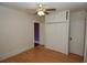 Bedroom featuring wood floors, closet, ceiling fan, and natural light at 1130 Ridge Ave, Stone Mountain, GA 30083