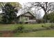 Quaint home with a screened porch and a beautifully landscaped yard at 1130 Ridge Ave, Stone Mountain, GA 30083