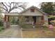 Front exterior of a home featuring a covered carport, inviting curb appeal, and a cozy front yard at 1130 Ridge Ave, Stone Mountain, GA 30083