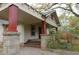 Inviting front porch with stone columns, steps, and a covered area, perfect for relaxing outdoors at 1130 Ridge Ave, Stone Mountain, GA 30083