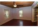 Living room with wooden floors, ample natural light, and open access to other rooms in the house at 1130 Ridge Ave, Stone Mountain, GA 30083