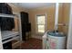 Utility room including shelving, closet and water heater at 1130 Ridge Ave, Stone Mountain, GA 30083